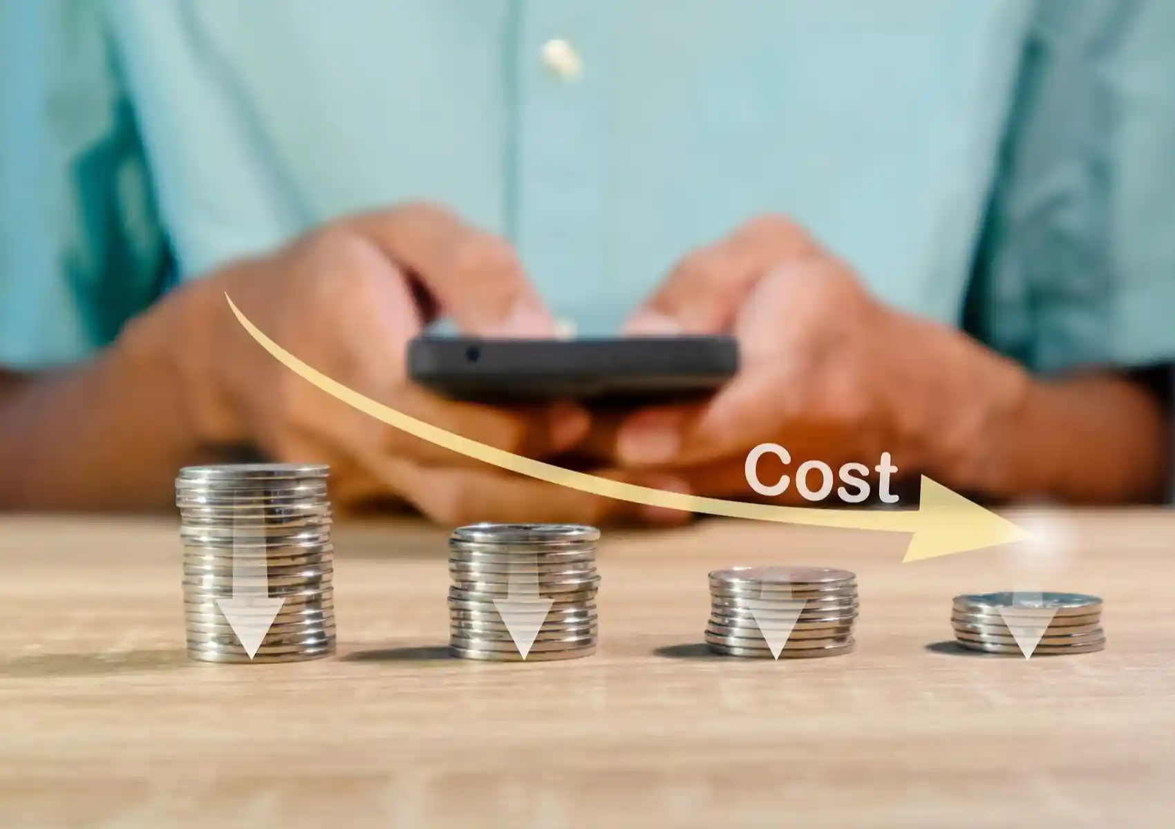 Decreasing stacks of coins with a downward arrow labeled Cost, demonstrating the cost efficiency and budget considerations when comparing SEO vs SEM.